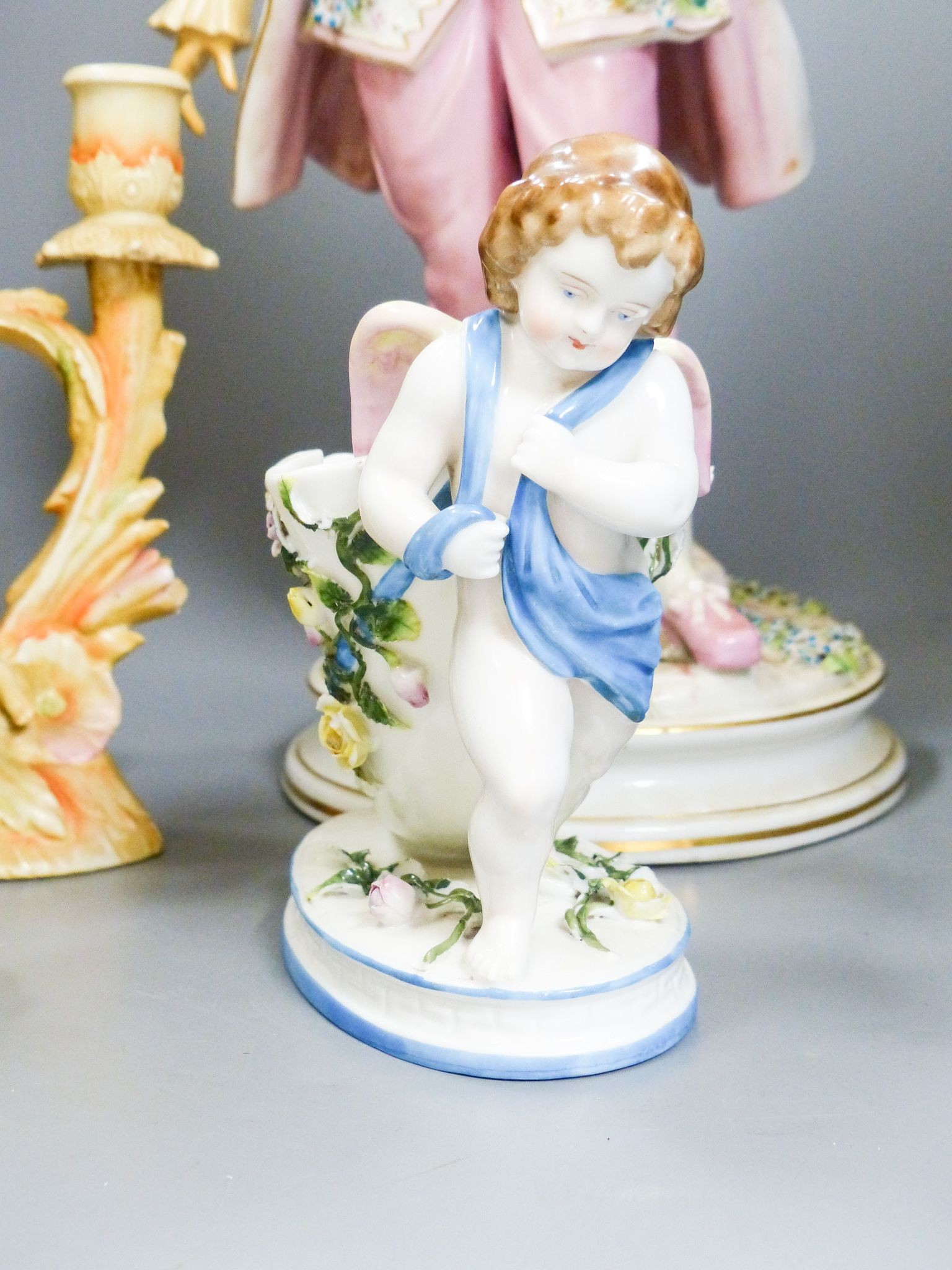 A bisque carriage centrepiece, a Continental figure and decorative items